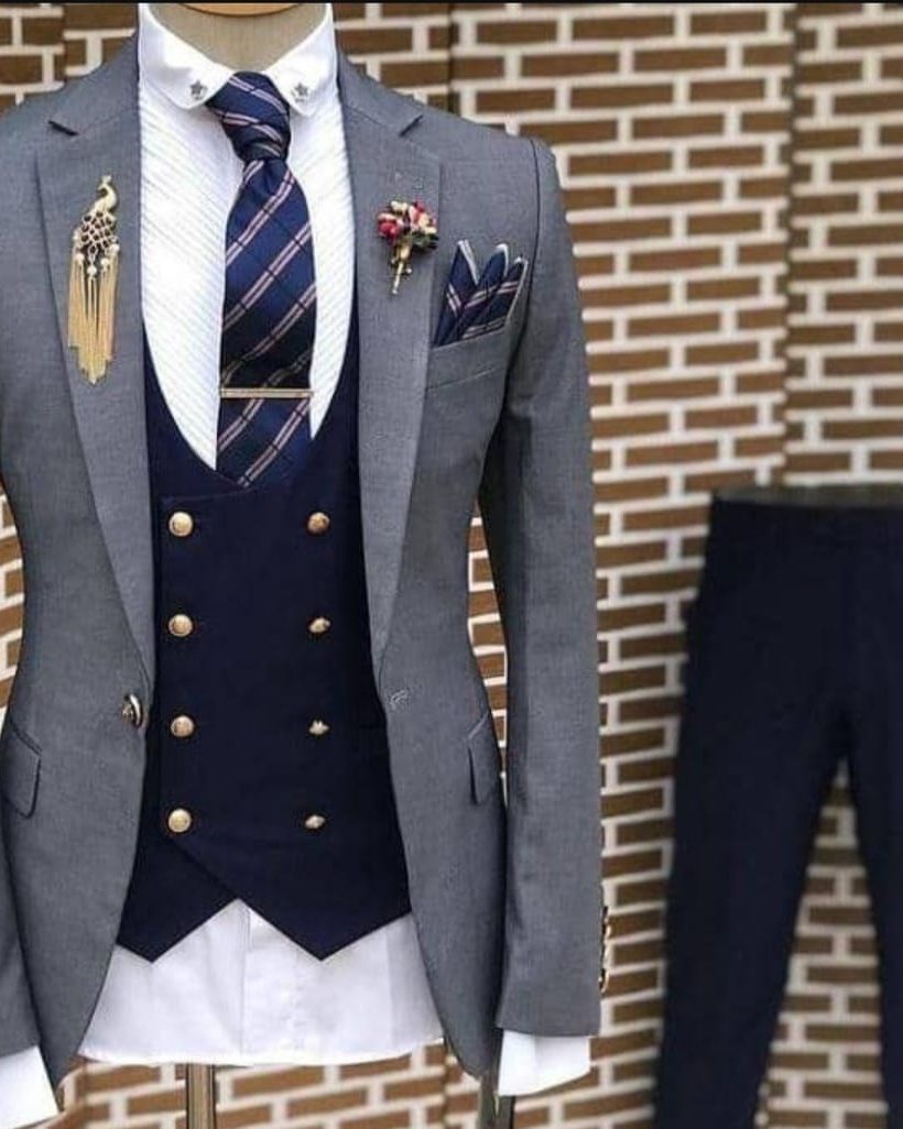 Charcoal grey suit with navy waistcoat, tailored for corporate wear