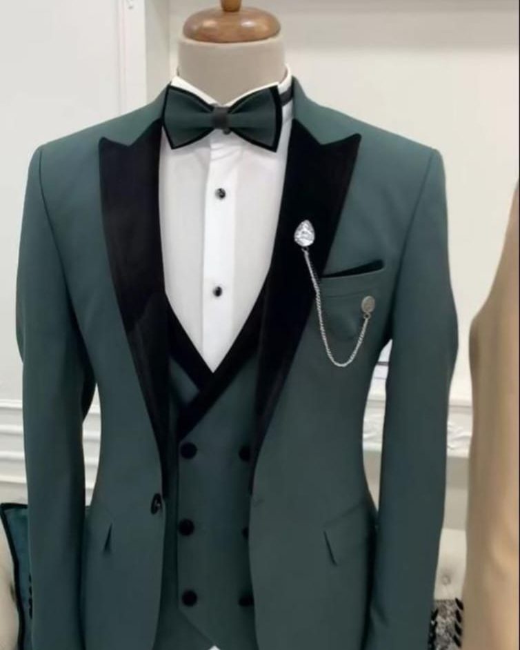 Emerald green tuxedo with black satin lapel and bow tie, statement occasion wear