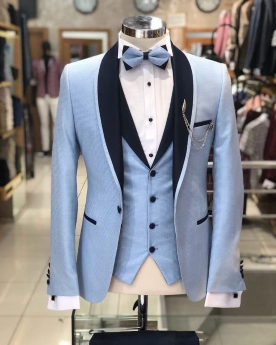 Sky blue slim-fit tuxedo with navy shawl lapel and bow tie, prom-ready
