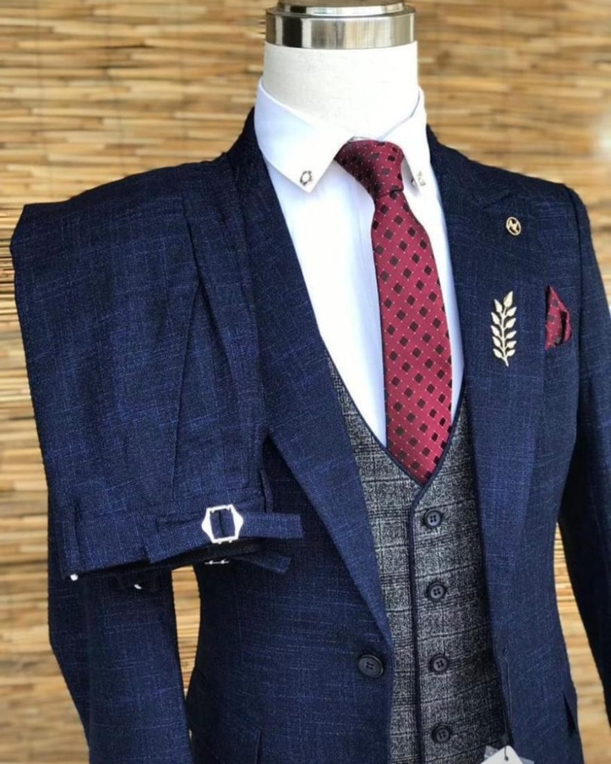 Navy windowpane check three-piece suit, full length with tailored trousers