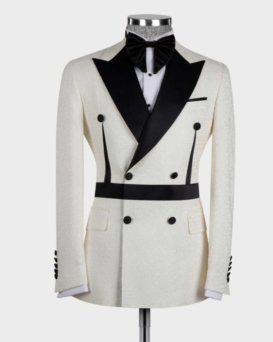 Ivory textured double-breasted jacket with black lapel and bow tie